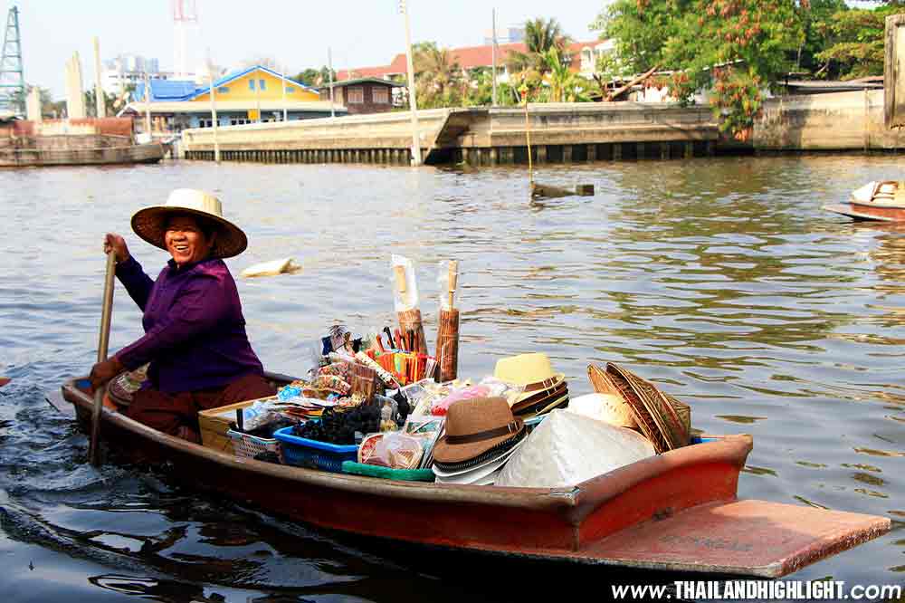 Merchant on Wooden boats at Bangkok Canal  traditional popular method still practiced in float market canals of Bangkok Thailand.